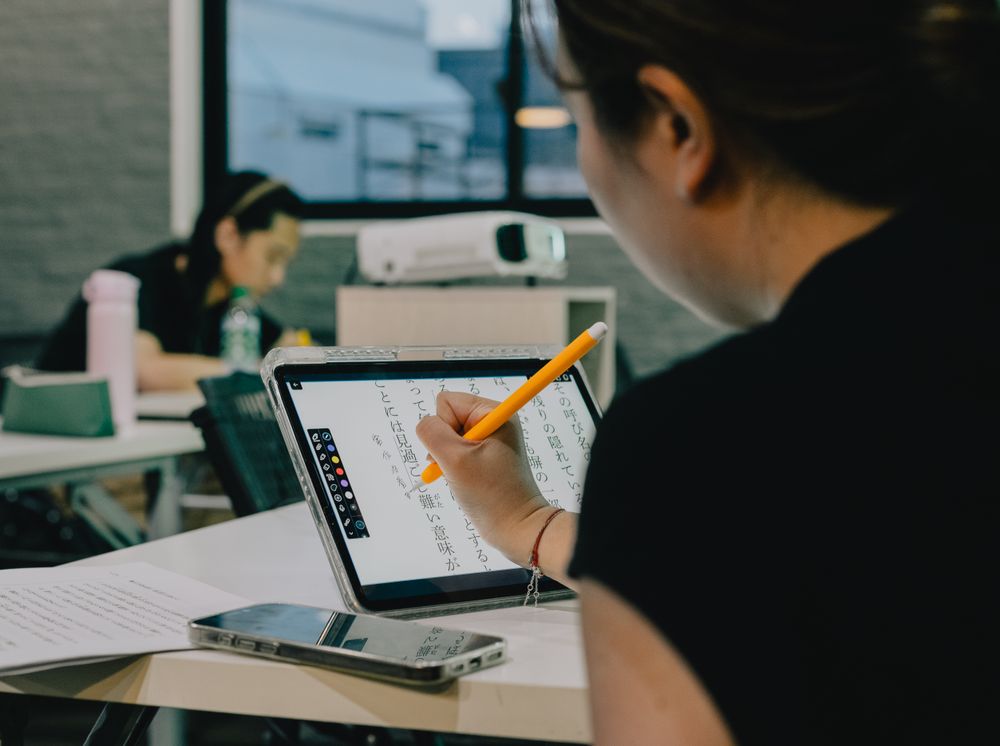 Students studying with a tablet