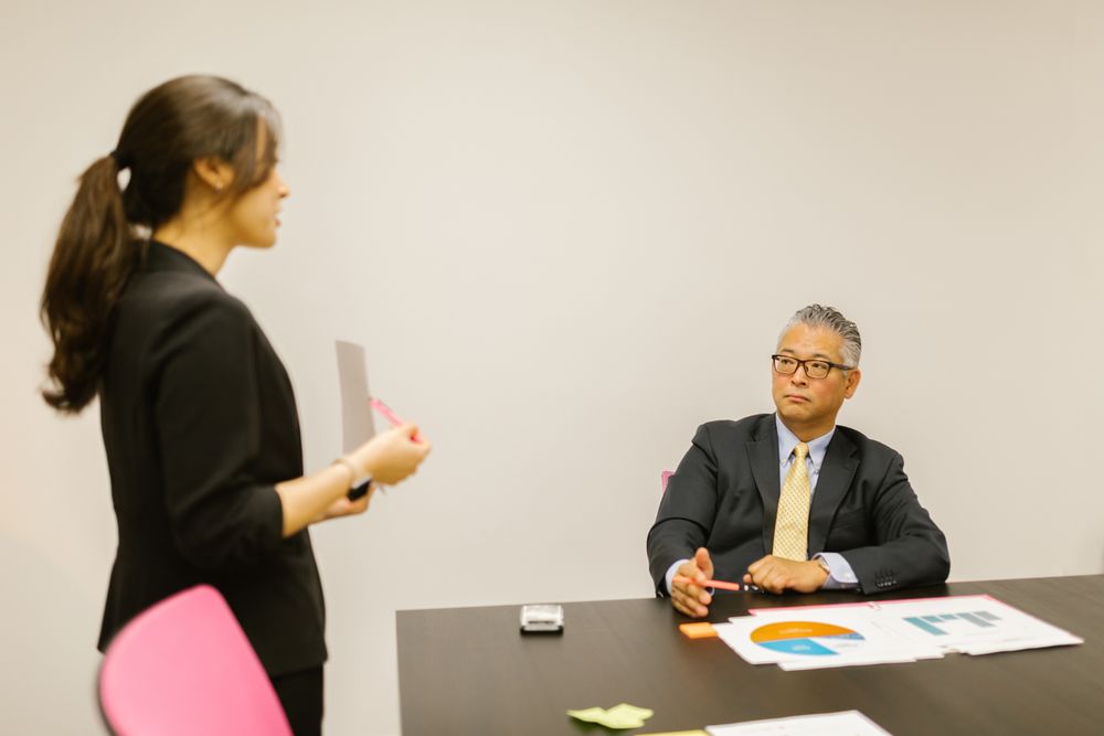 A woman presenting in an office meeting