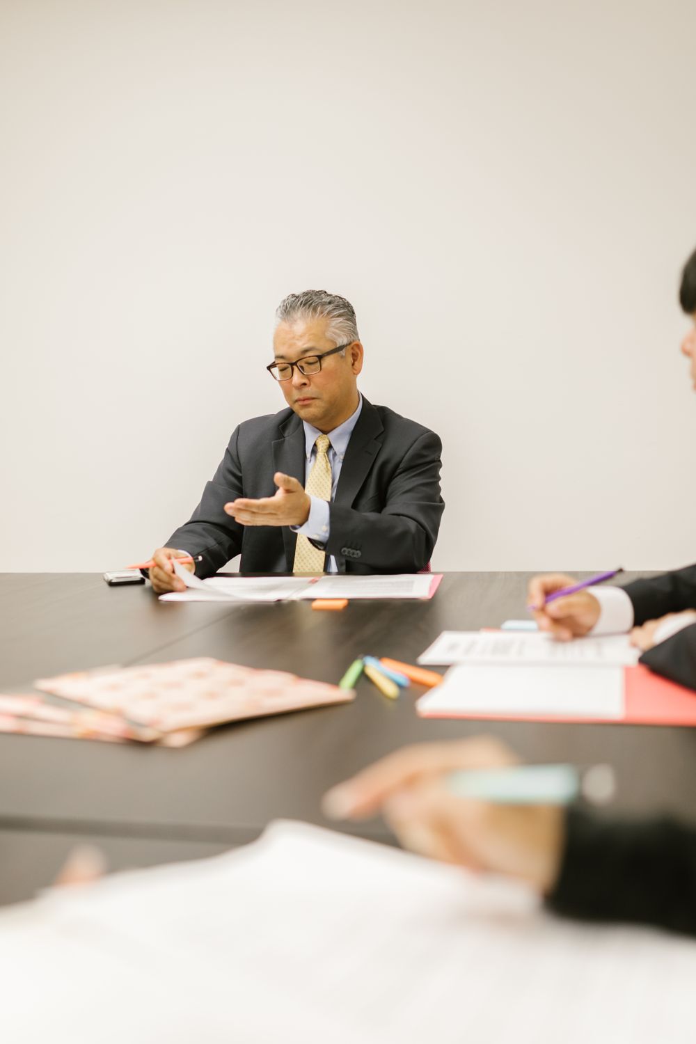 A businessman speaking in a meeting